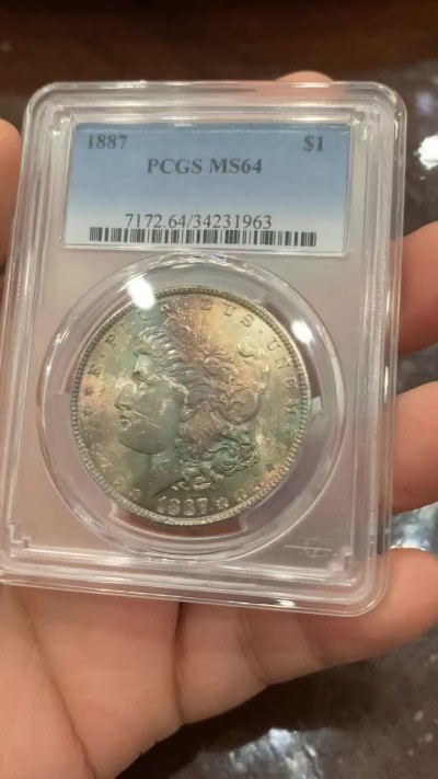 《竞宝斋》第123场-周日，周一 ，2场连拍（全场包邮） PCGS MS64 美国 1887年 摩根银币 五彩+环彩包浆 状态非常好