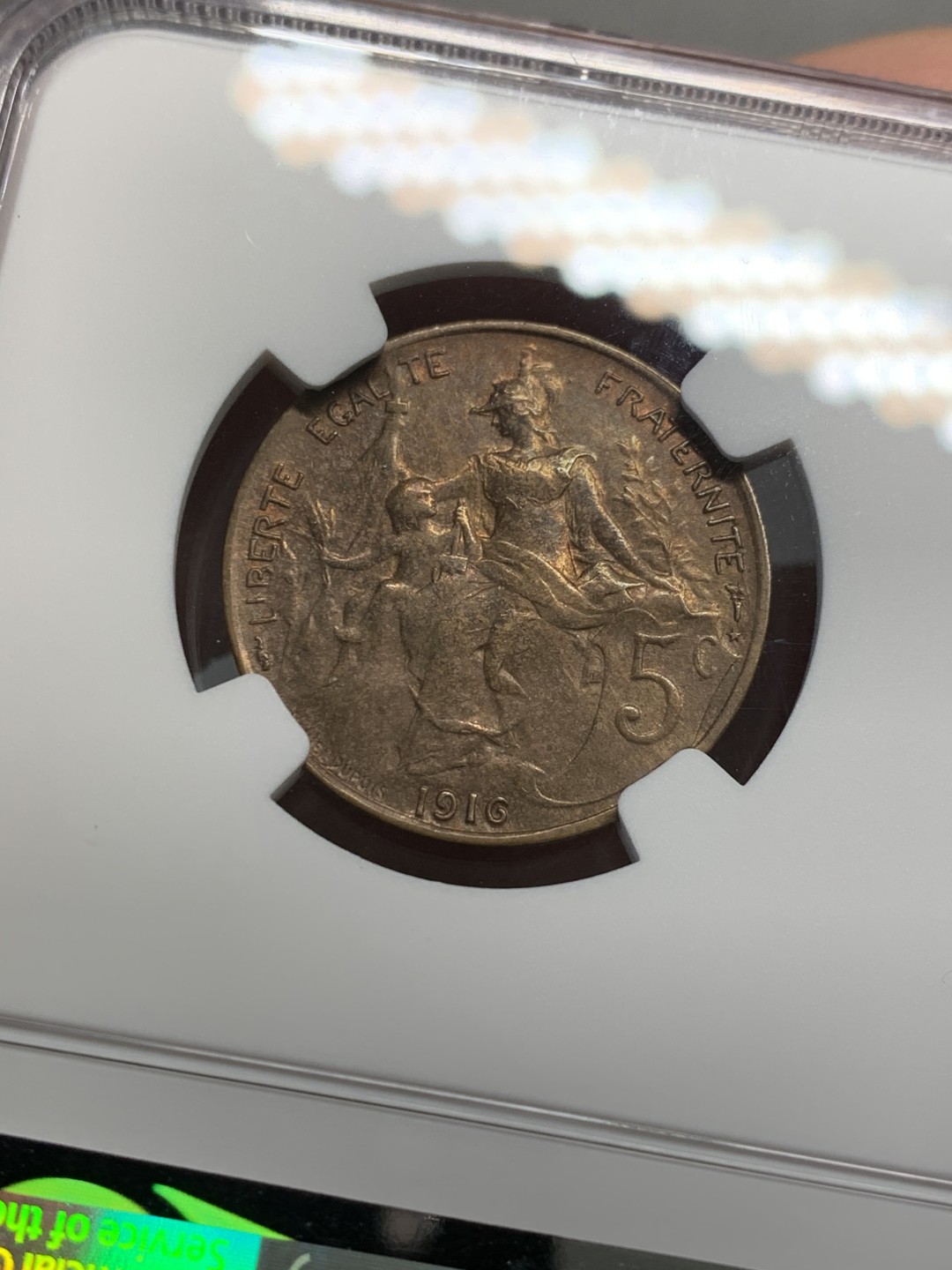 《竞宝斋》第128场-周日，周一 ，2场连拍（全场包邮） 季军分 NGC-AU55BN 1916年 法国玛丽安娜女神5分铜币 铜光泛彩，状态非常好。流通充分的辅币，高分少