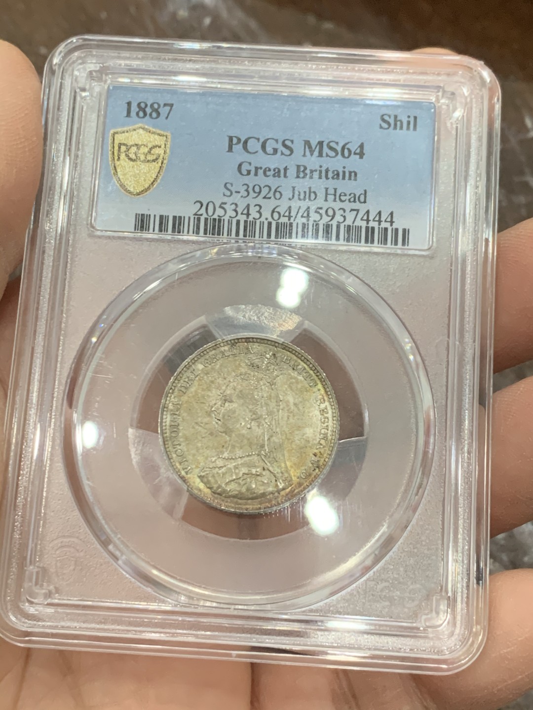 《竞宝斋》第128场-周日，周一 ，2场连拍（全场包邮） PCGS MS64 英国 1887年一先令银币，五彩包浆，收藏级别，非常精致
