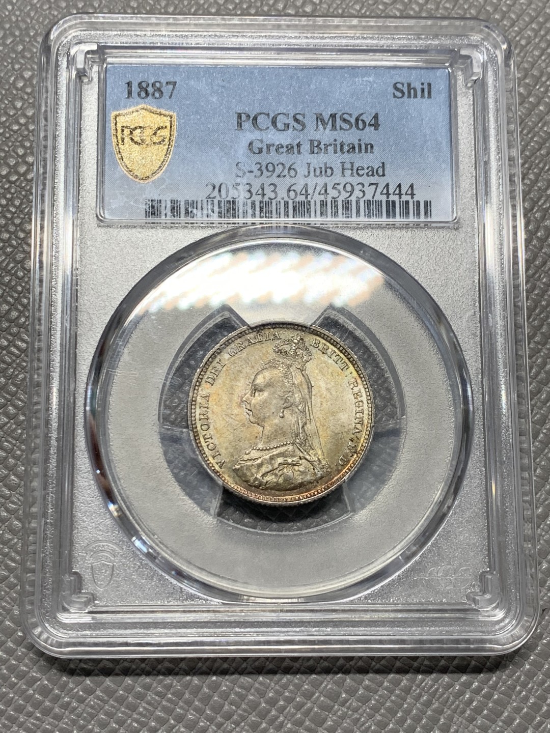 《竞宝斋》第128场-周日，周一 ，2场连拍（全场包邮） PCGS MS64 英国 1887年一先令银币，五彩包浆，收藏级别，非常精致