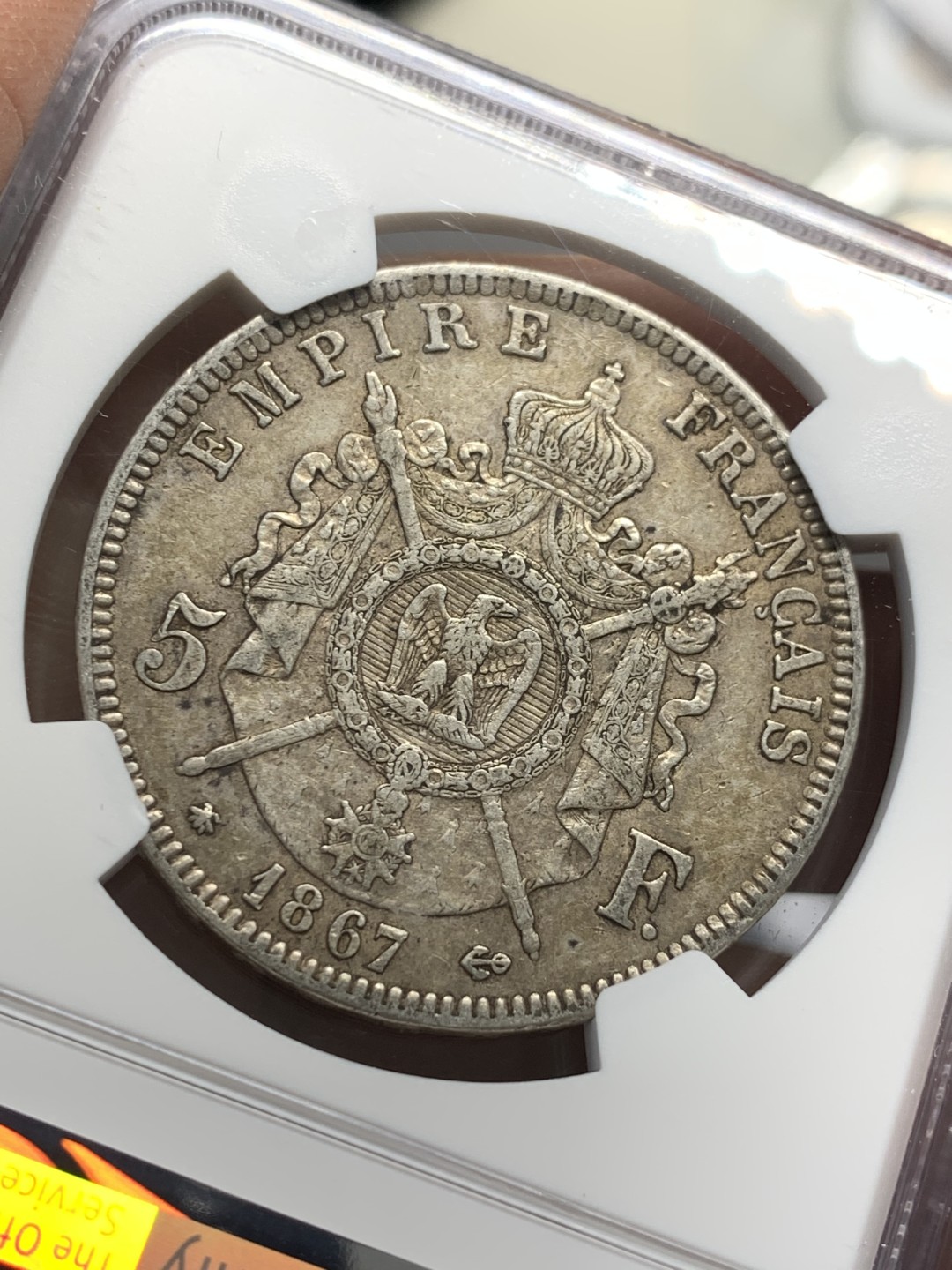 《竞宝斋》第128场-周日，周一 ，2场连拍（全场包邮） NGC AU 法国 1867年 拿三 5法郎银币 原味包浆 细节好 我都没看出 DAMAGE 在哪里