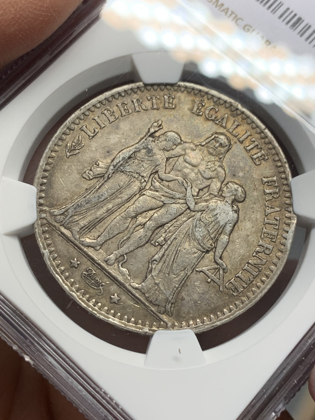 《竞宝斋》第128场-周日，周一 ，2场连拍（全场包邮） NGC AU53 法国 1875年 大力神 5法郎银币 深包浆 小A版 发行量是1873的1/10