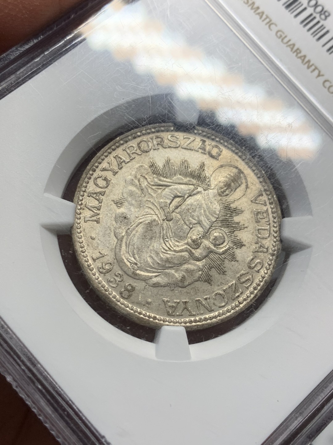 《竞宝斋》第128场-周日，周一 ，2场连拍（全场包邮） NGC-MS63 匈牙利1938年 2潘果银币 圣母抱婴  带转光 底板干净