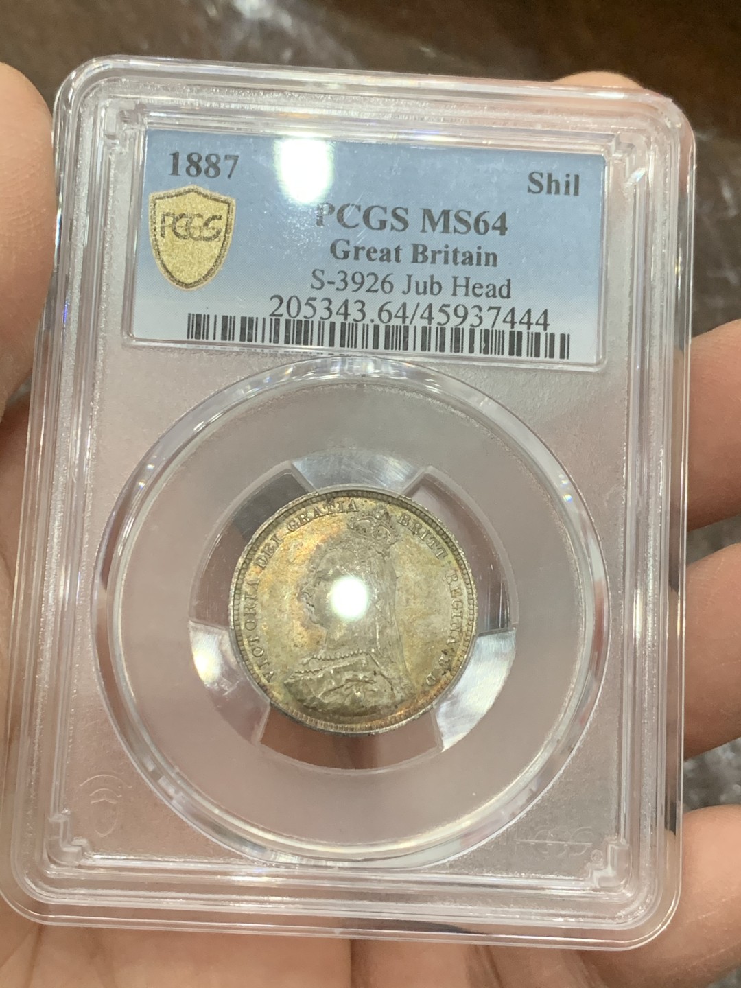 《竞宝斋》第128场-周日，周一 ，2场连拍（全场包邮） PCGS MS64 英国 1887年一先令银币，五彩包浆，收藏级别，非常精致