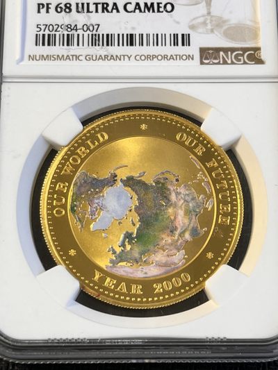 【海寧潮】帕劳1999年千禧年我们的世界1盎司纯金彩金币NGC-PF68，999金，1盎司