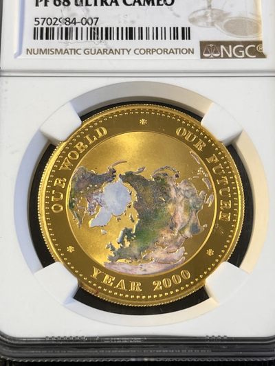 【海寧潮】帕劳1999年千禧年我们的世界1盎司纯金彩金币NGC-PF68，999金，1盎司
