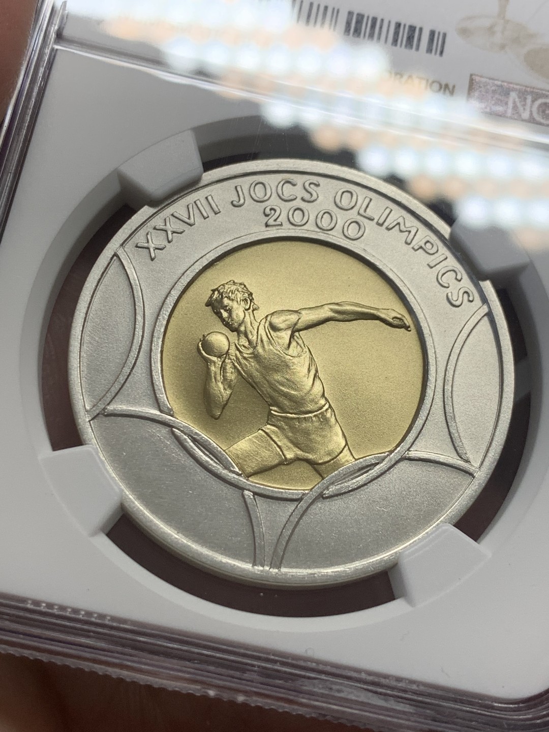 《竞宝斋》第130场-周日，周一连拍 (全场包邮) 唯一冠军分 NGC-MS69 安道尔1999年 悉尼奥运铅球 20第纳尔大银币 含1.5克金 发行量5000枚