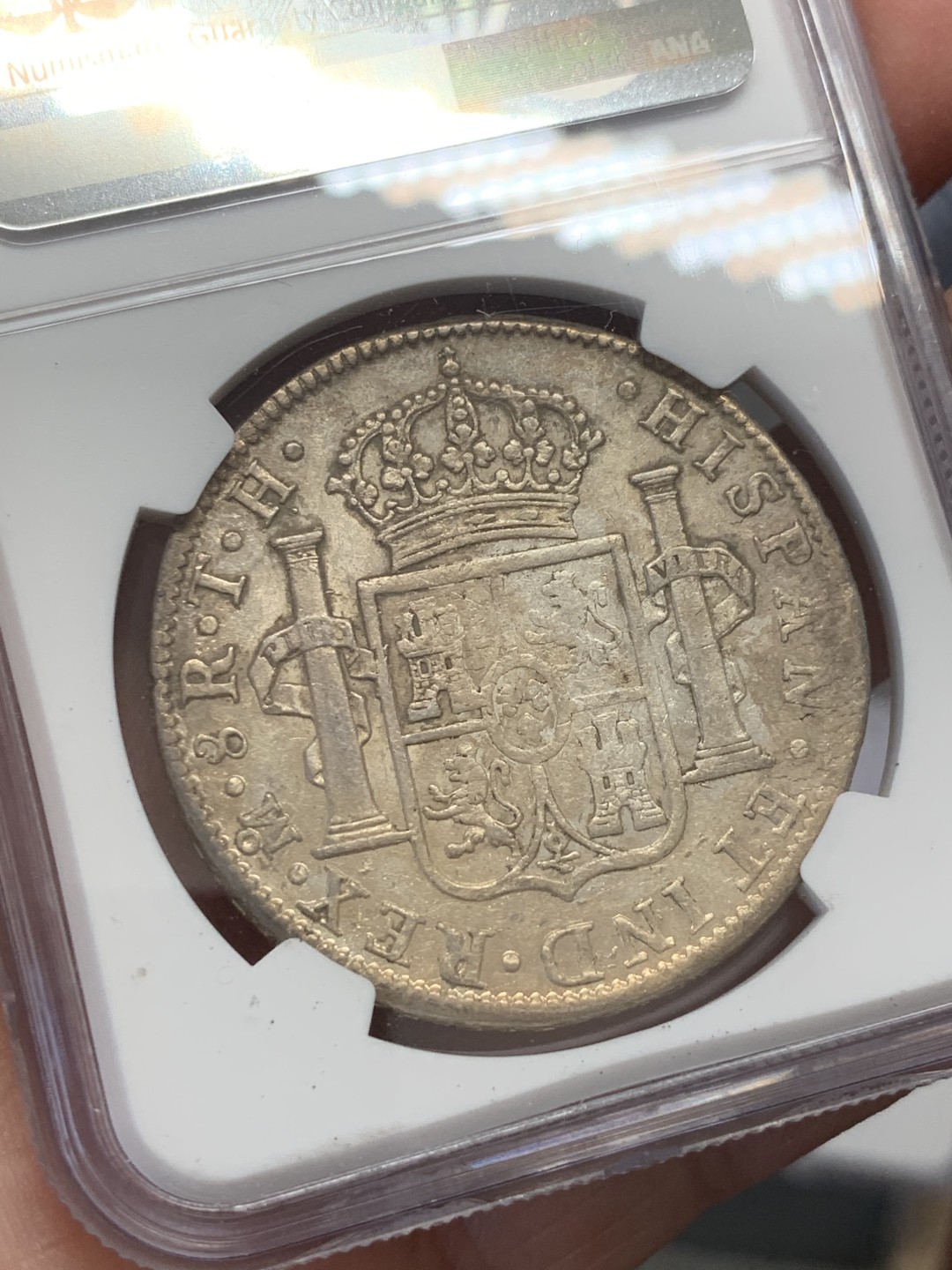 《竞宝斋》第131场-周日，周一连拍 (全场包邮) NGC AU 墨西哥 1805年 卡四 双柱 8R 大银币 打制的还不错 原味状态