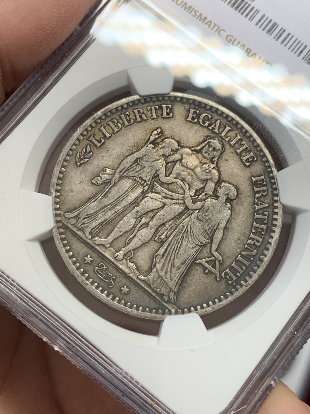 《竞宝斋》第131场-周日，周一连拍 (全场包邮) NGC-AU53 法国 1875年小a版 大力神 5法郎 银币 数量比1873年少太多