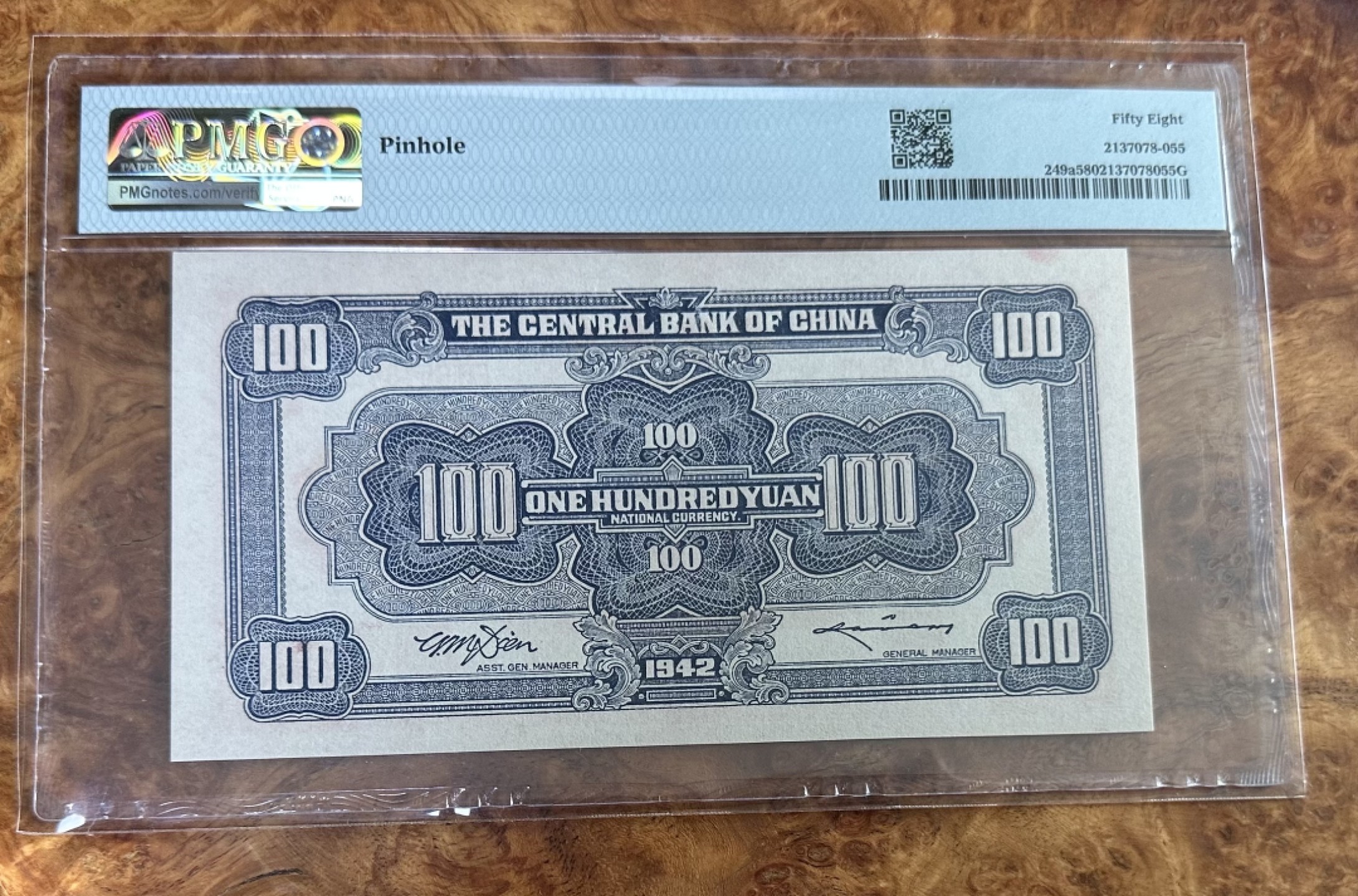Chase Auction 第16期 - - 外钞、民国钞和一版人民币混合场！ 1942年民国中央银行100元，信托版版红牌坊，PMG58分！