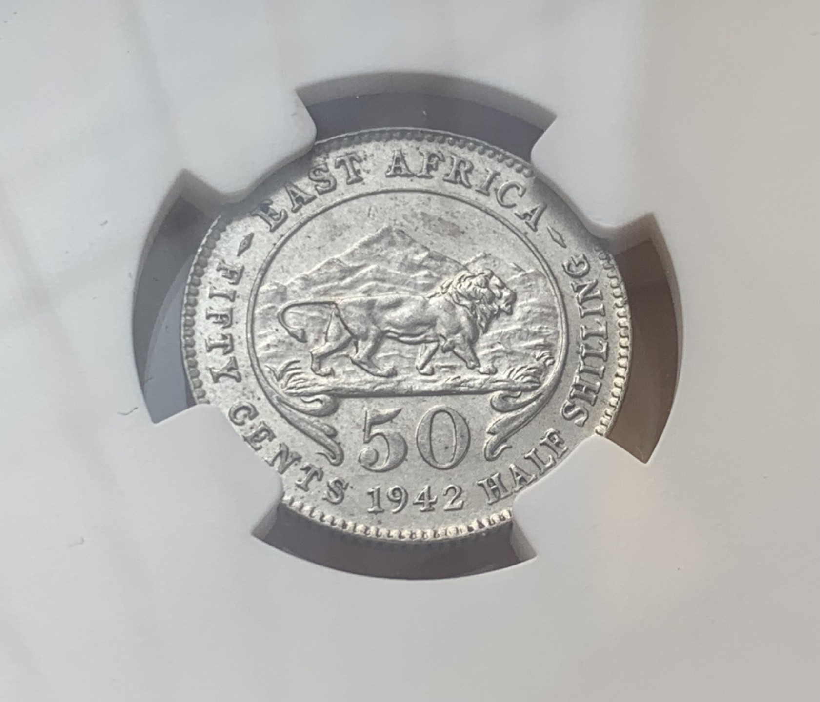 瓶子🏺第77期拍卖会 东非1942年乔六50分银币带光