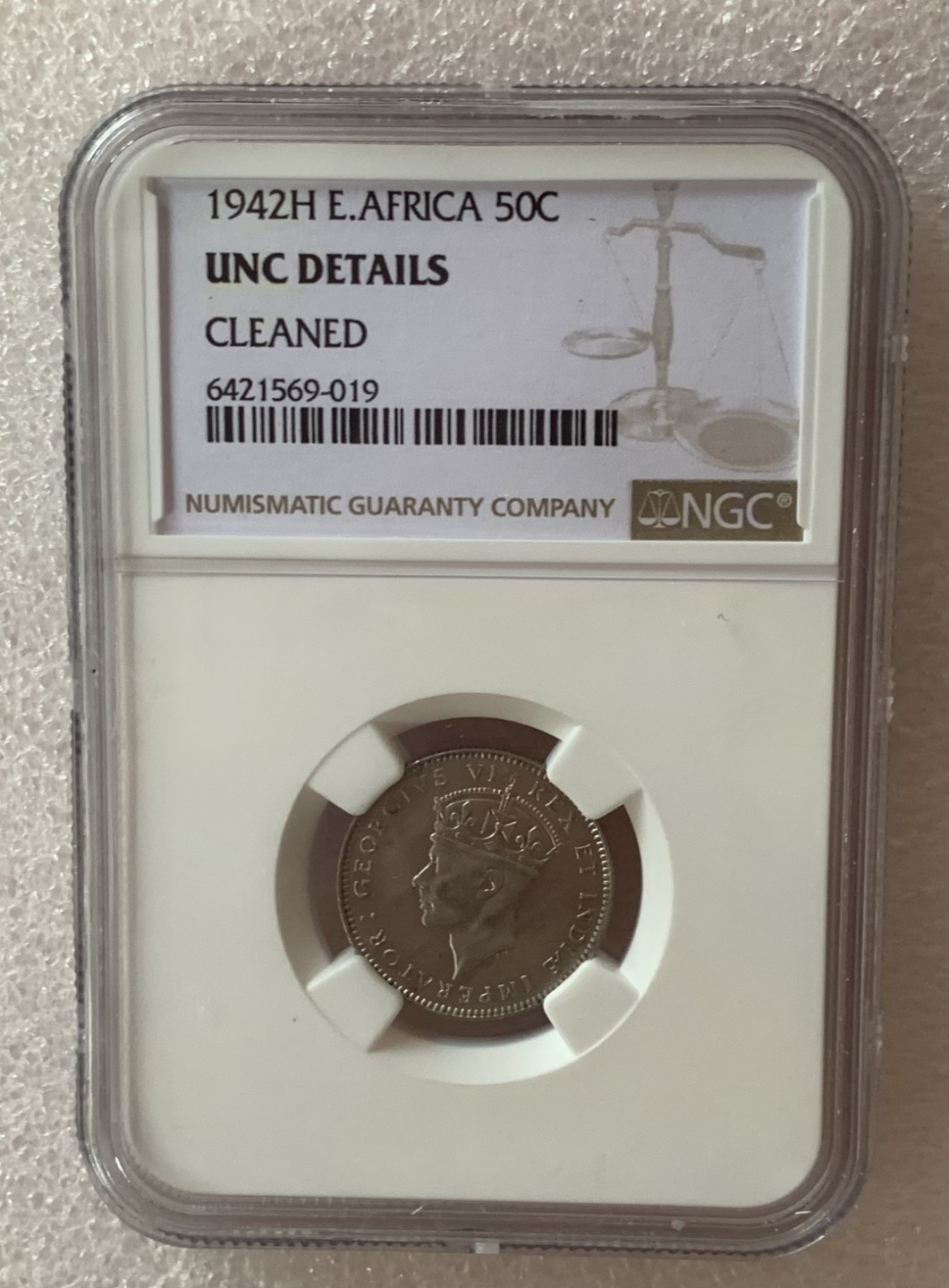 瓶子🏺第77期拍卖会 东非1942年乔六50分银币带光