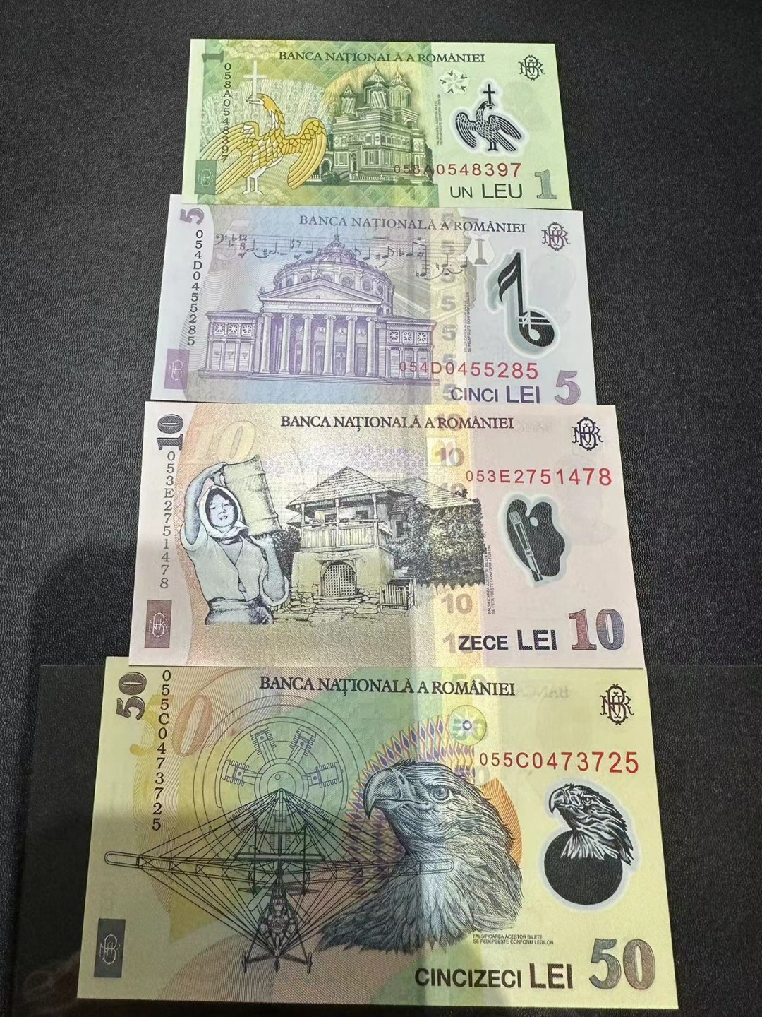《外钞收藏家》第二百三十九期（罗马尼亚、保加利亚专场） 罗马尼亚2005年1/5/10/50列伊塑料钞，共4枚	P117-120 全新