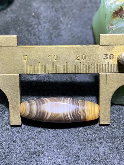 缠丝玛瑙直桶通货桶珠一个 缠丝玛瑙直桶通货桶珠一个