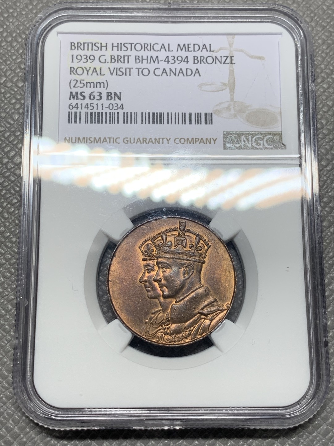 《竞宝斋》第136场-周日，周一连拍 (全场包邮) NGC-MS63BN 英国 1939年 乔治六世 皇室首次访问加拿大纪念铜章。厚重小铜章，背面加拿大地图，河流细节雕琢惊人。铜光亮眼，63高分不易。