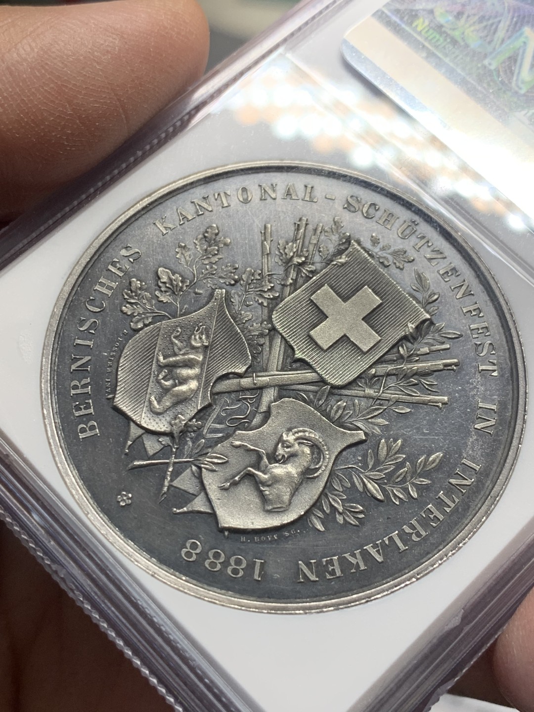 《竞宝斋》第136场-周日，周一连拍 (全场包邮) NGC UND 1888年瑞士因特拉尔肯射击节银章，稀少品种，五彩包浆，镜面底板，可以再试试