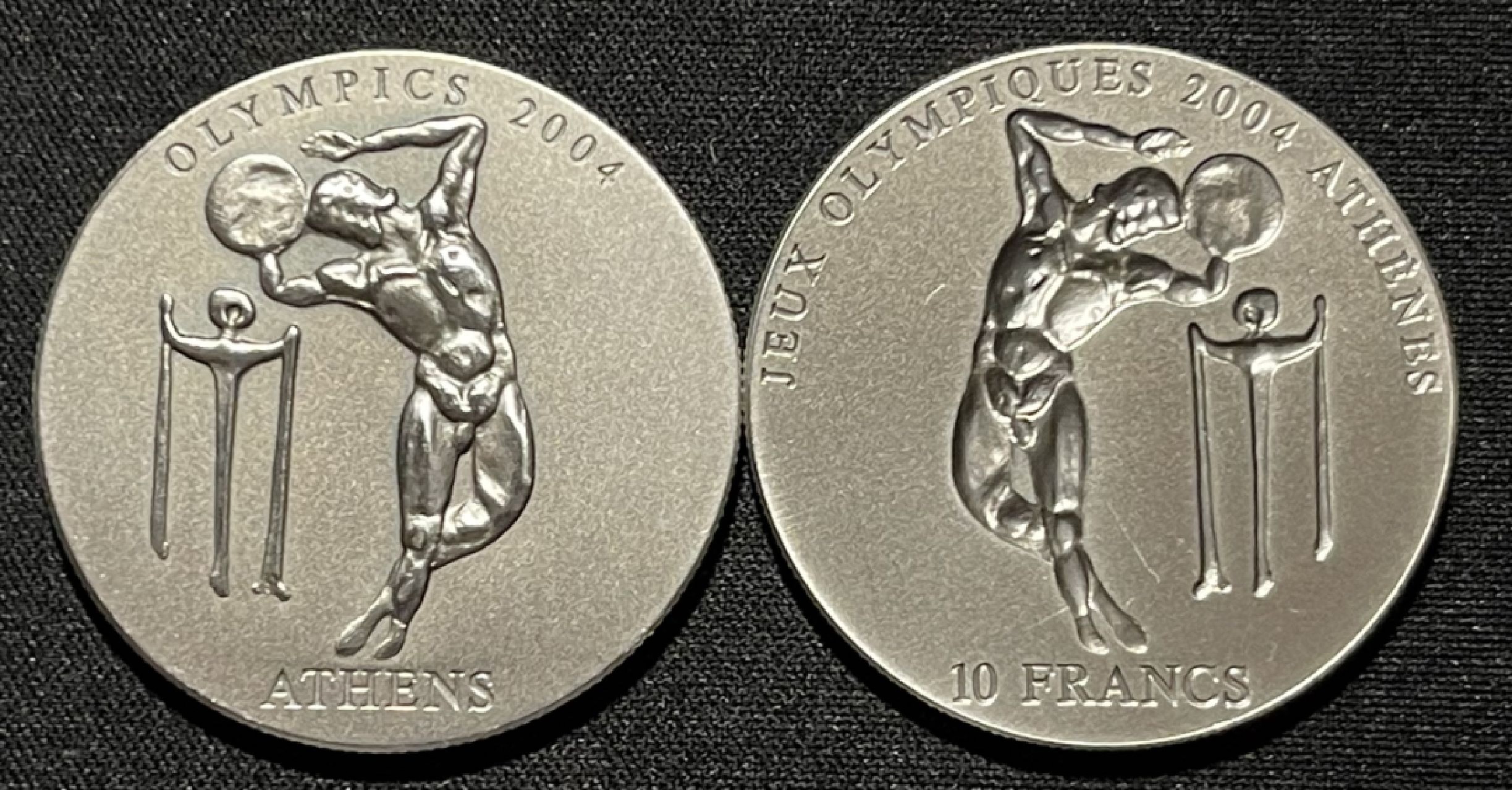 紫瑗钱币——第264期拍卖 刚果 加纳 2002年 联合发行 雅典奥运会 铁饼 10法郎 500塞地 阴阳币 共62.2克 0.999银