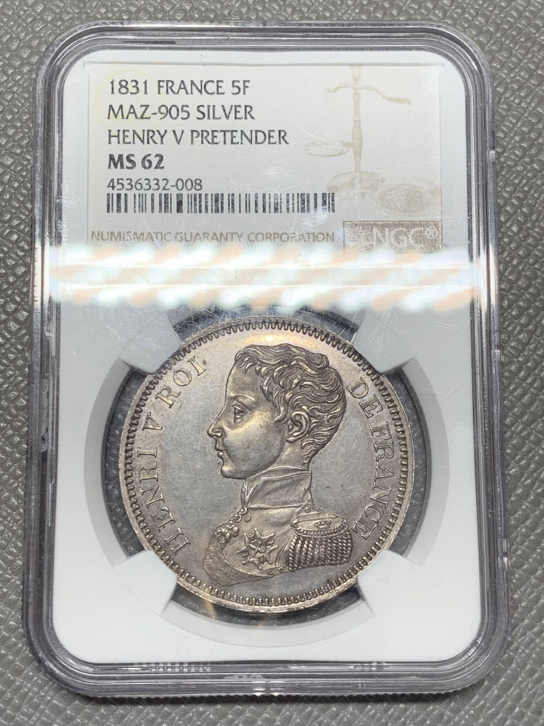 《竞宝斋》第141场-周日，周一 2场 (全场包邮) NGC-MS62 1831年法国亨利五世5法郎样币 亨利五世仅仅做了7天的法国国王就被迫让位给路易菲利普，他是正统派的拥立对象。此币铁灰包浆，状态不错