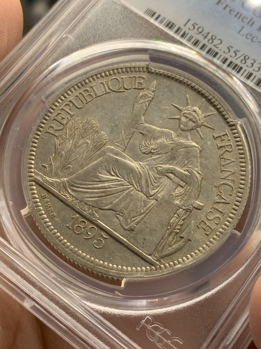 《竞宝斋》第141场-周日，周一 2场 (全场包邮) PCGS AU55 法属印支 1895年 加重版 坐人 银币 整体细节很不错  上AU的加重 不容易