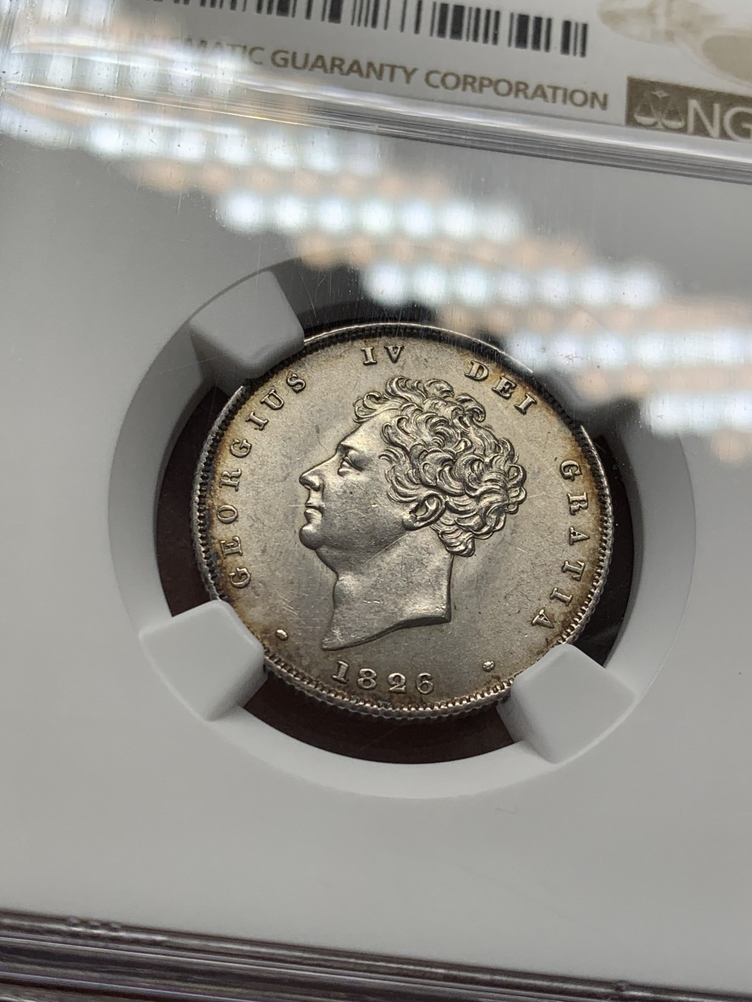 《竞宝斋》第141场-周日，周一 2场 (全场包邮) NGC UNC 英国 1826年 乔治四世先令银币 未见明显缺陷 品相细节很好