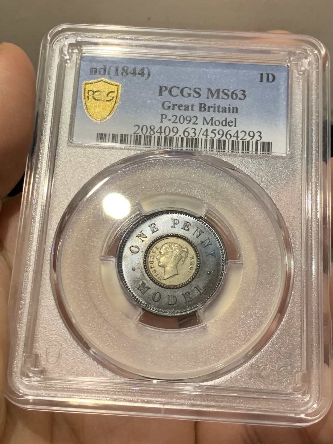 《竞宝斋》第141场-周日，周一 2场 (全场包邮) PCGS MS63 亚军分 英国 1844年 维多利亚女王 1便士双色model 世界上早期的双色币 外环均匀紫罗兰包浆氧化光彩动人 PC广告币 63中很好看的一枚