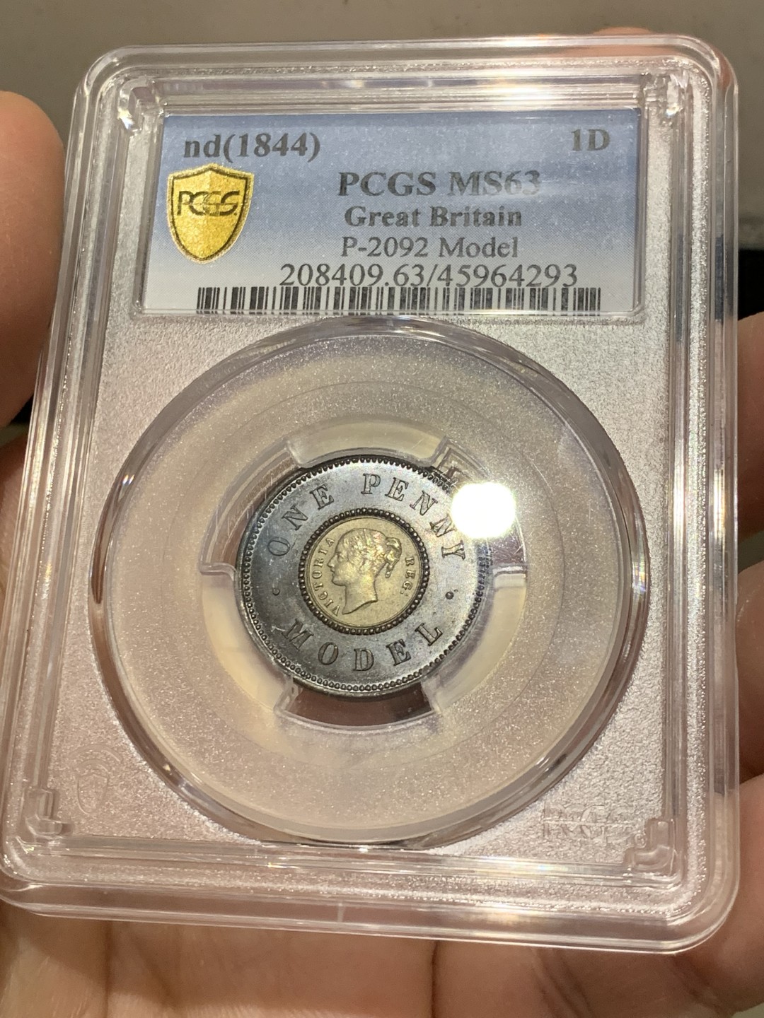 《竞宝斋》第141场-周日，周一 2场 (全场包邮) PCGS MS63 亚军分 英国 1844年 维多利亚女王 1便士双色model 世界上早期的双色币 外环均匀紫罗兰包浆氧化光彩动人 PC广告币 63中很好看的一枚