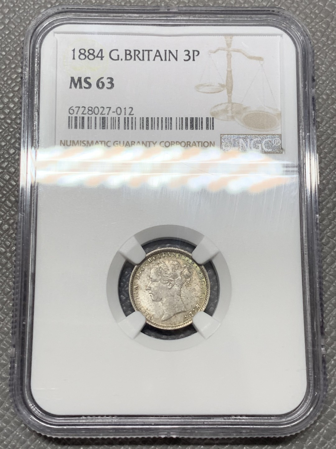 《竞宝斋》第141场-周日，周一 2场 (全场包邮) NGC MS 63 1884年英国小维3便士银币 五彩包浆状态好