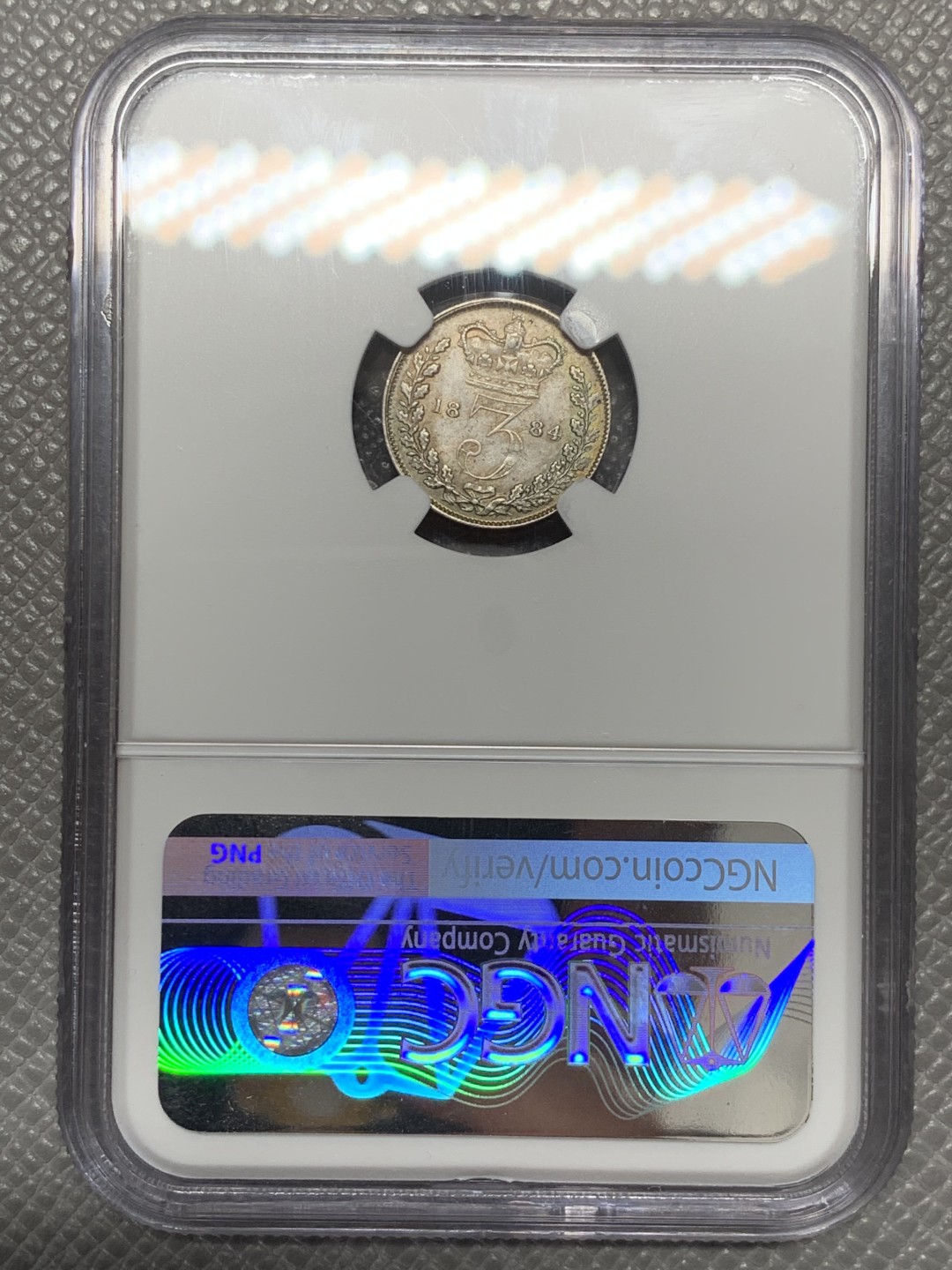 《竞宝斋》第141场-周日，周一 2场 (全场包邮) NGC MS 63 1884年英国小维3便士银币 五彩包浆状态好