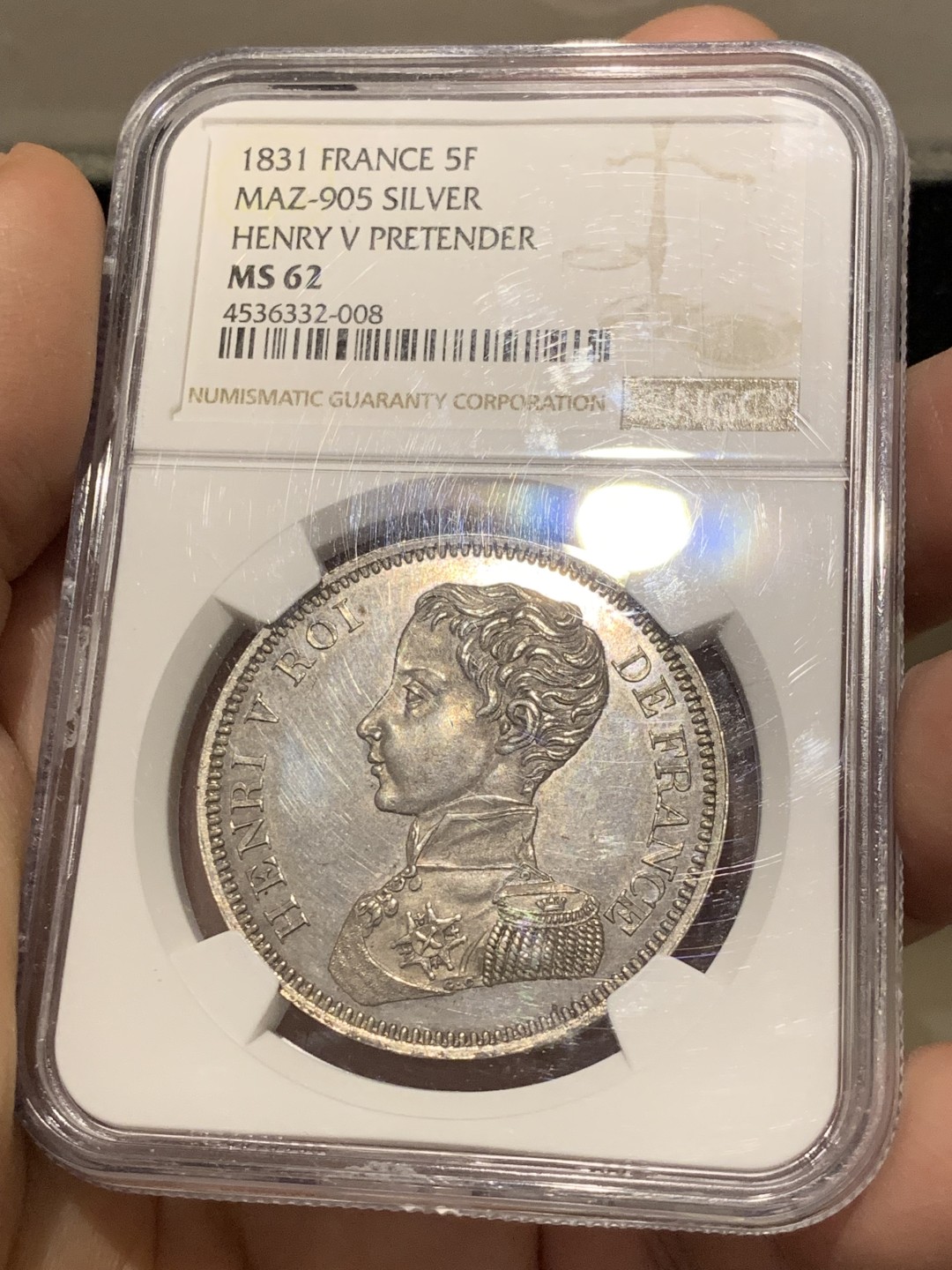 《竞宝斋》第141场-周日，周一 2场 (全场包邮) NGC-MS62 1831年法国亨利五世5法郎样币 亨利五世仅仅做了7天的法国国王就被迫让位给路易菲利普，他是正统派的拥立对象。此币铁灰包浆，状态不错