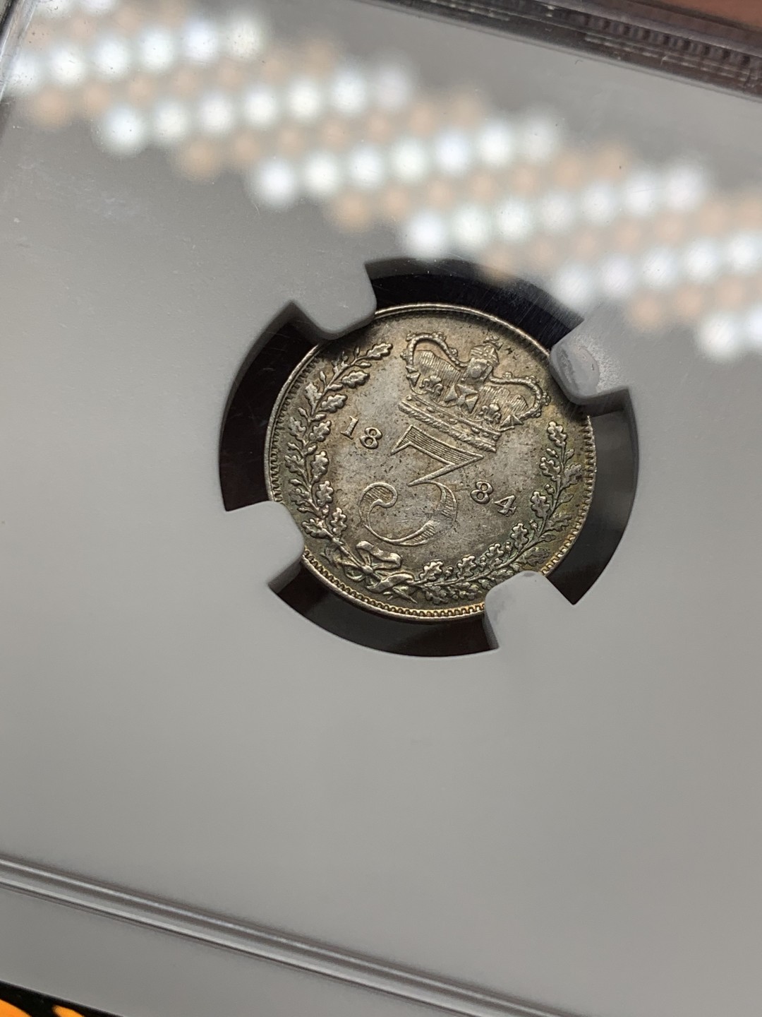 《竞宝斋》第141场-周日，周一 2场 (全场包邮) NGC MS 63 1884年英国小维3便士银币 五彩包浆状态好