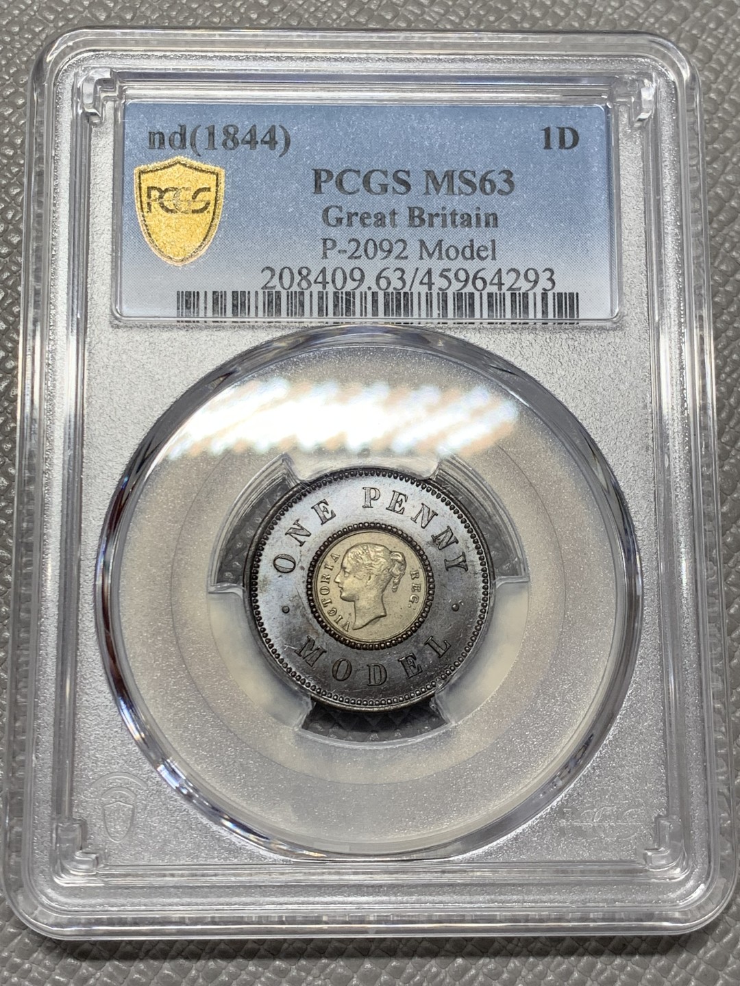 《竞宝斋》第141场-周日，周一 2场 (全场包邮) PCGS MS63 亚军分 英国 1844年 维多利亚女王 1便士双色model 世界上早期的双色币 外环均匀紫罗兰包浆氧化光彩动人 PC广告币 63中很好看的一枚