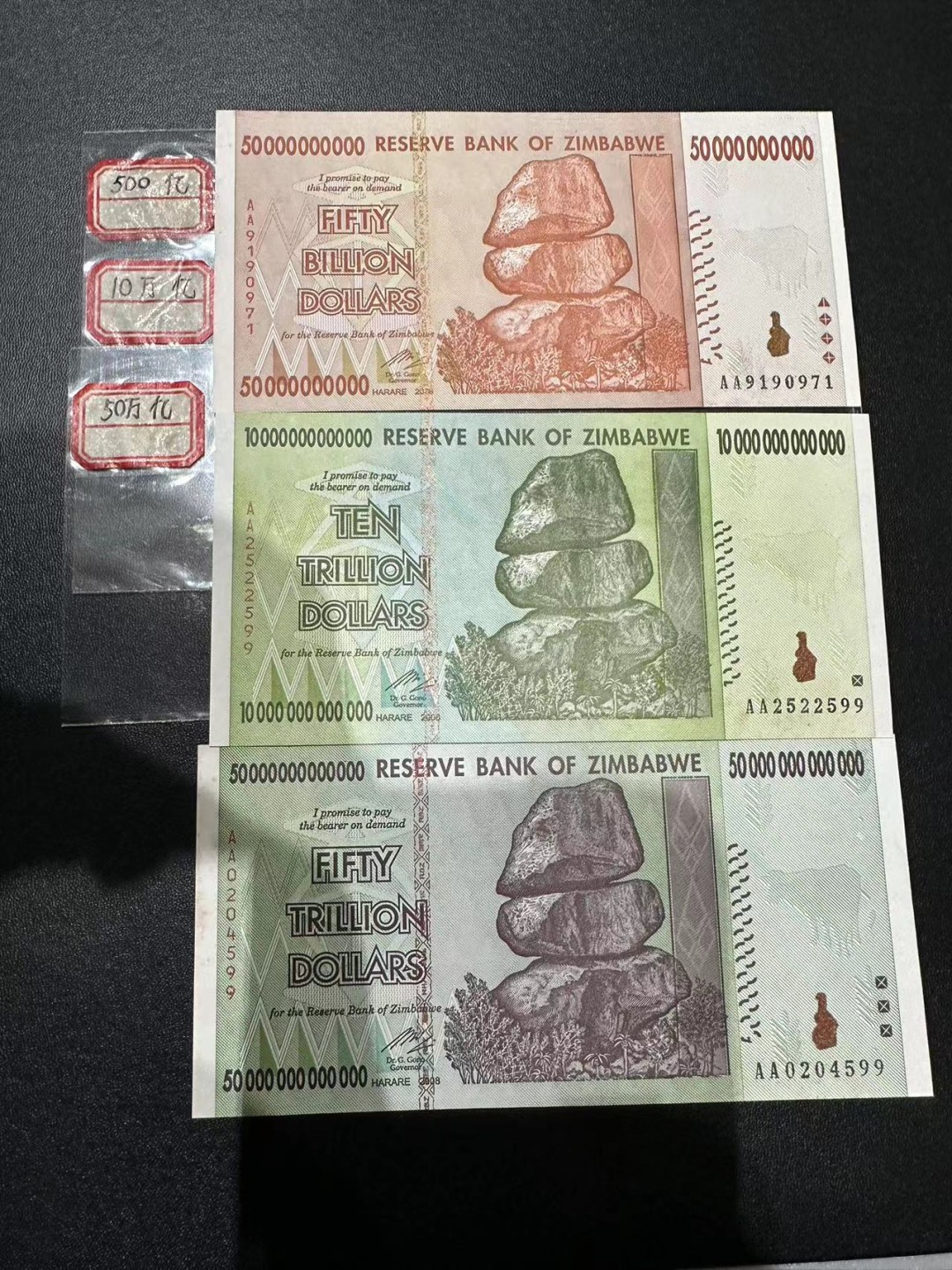 《外钞收藏家》第二百四十九期（连拍第二场） 津巴布韦500亿、10万亿、50万亿三张一起 无折 有潮癍