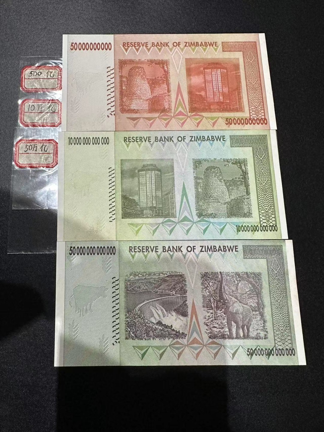 《外钞收藏家》第二百四十九期（连拍第二场） 津巴布韦500亿、10万亿、50万亿三张一起 无折 有潮癍