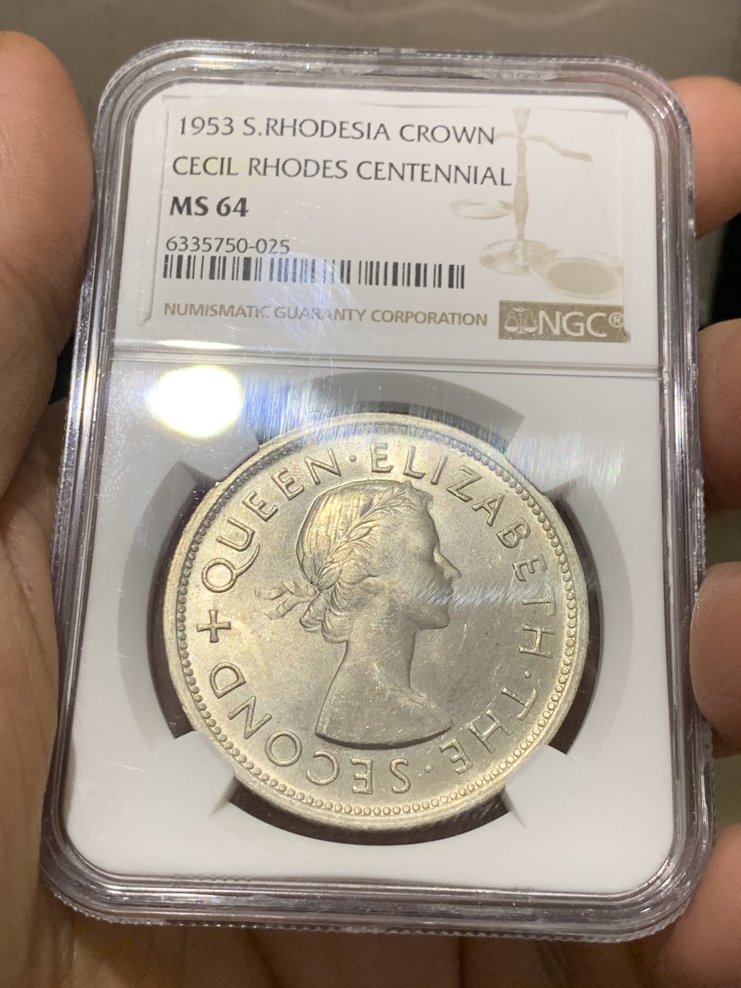 《竞宝斋》第143场-周日，周一 2场 (全场包邮) NGC  MS64 南罗德西亚1953年1克朗银币正面伊丽莎白二世女王背面殖民地头子伊安·史密斯发行的第一枚银币