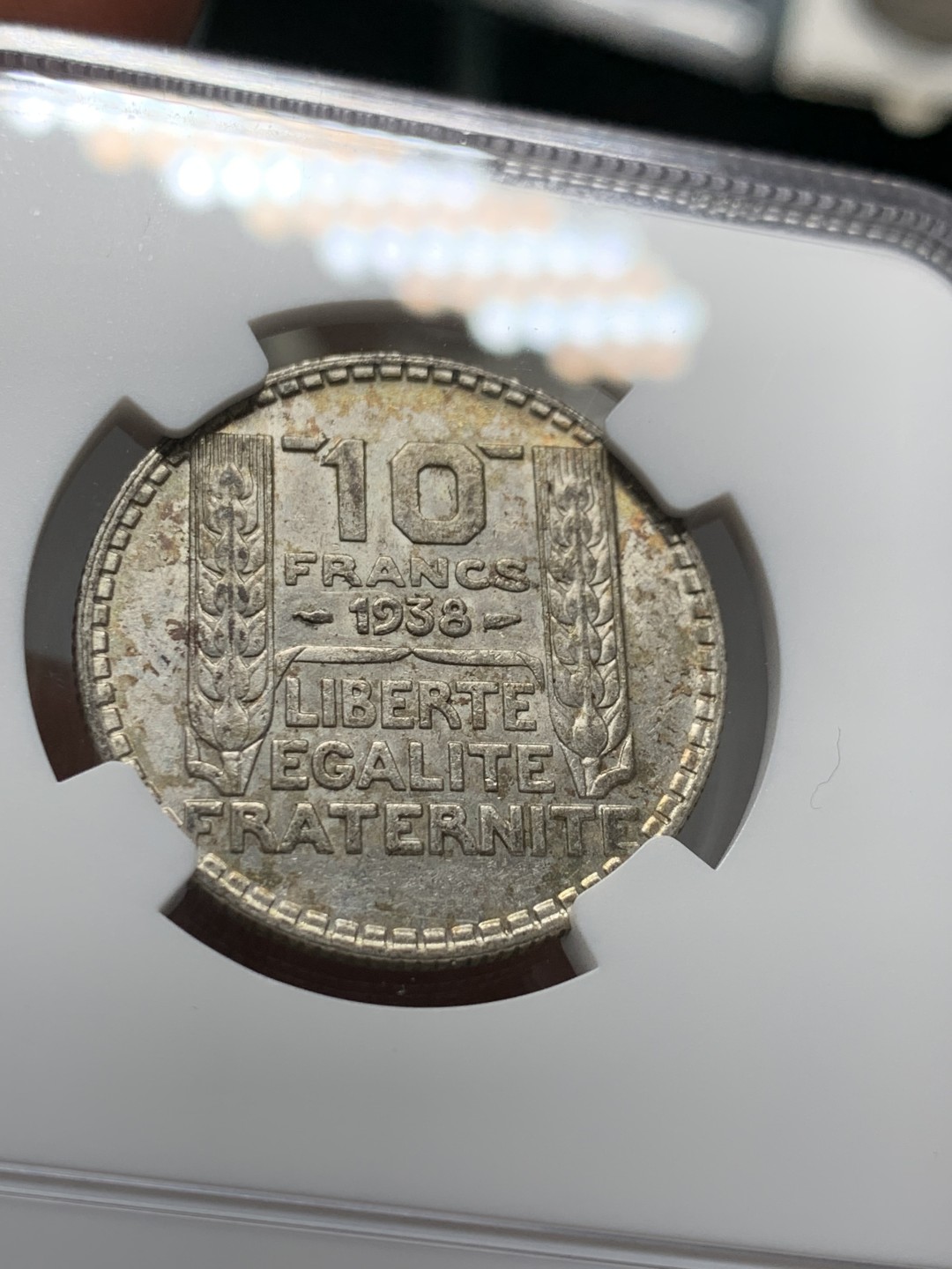 《竞宝斋》第143场-周日，周一 2场 (全场包邮) NGC-AU58 法国1938年 谷物女神10法郎银币 五彩包浆 低评