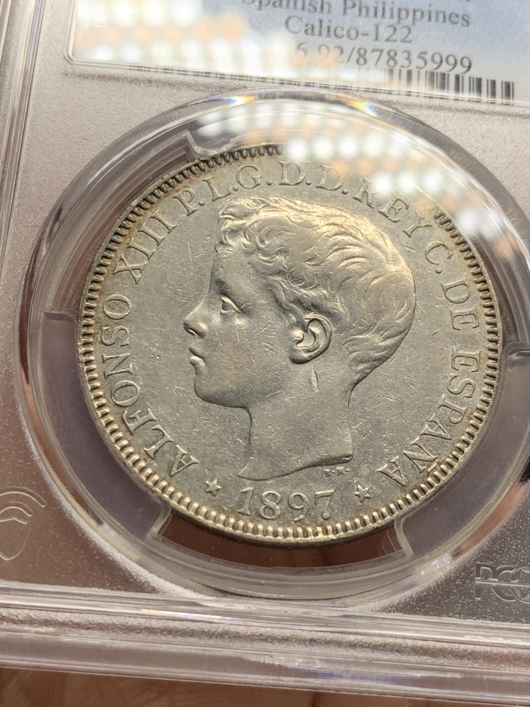 《竞宝斋》第143场-周日，周一 2场 (全场包邮) PCGS-AUD 西属菲律宾 1897年 阿方索十三世 1比索 银币 西属系列少见品种