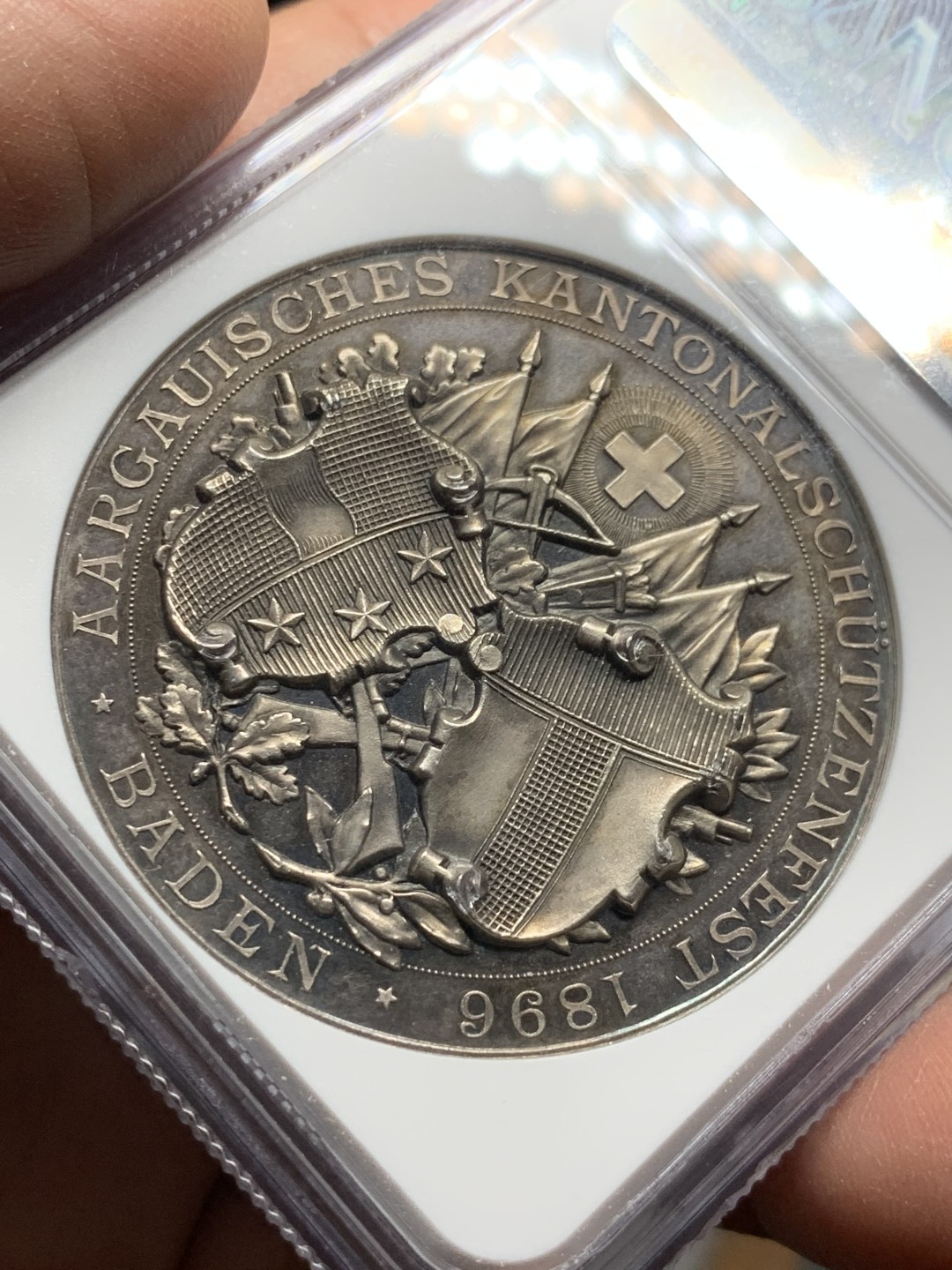 《竞宝斋》第143场-周日，周一 2场 (全场包邮) NGC MS63 1896年 瑞三阿尔高射击节银章 稀少热门品种 镜面底板 高分品质 高点俱在,近乎完美,收藏一步到位