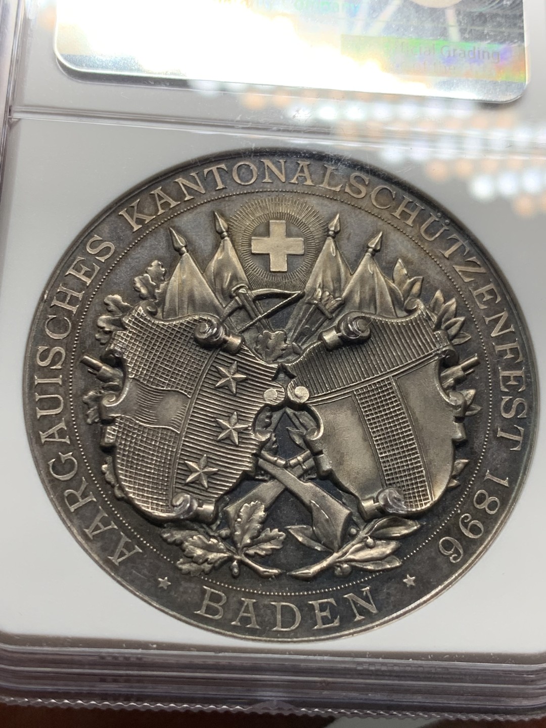 《竞宝斋》第143场-周日，周一 2场 (全场包邮) NGC MS63 1896年 瑞三阿尔高射击节银章 稀少热门品种 镜面底板 高分品质 高点俱在,近乎完美,收藏一步到位