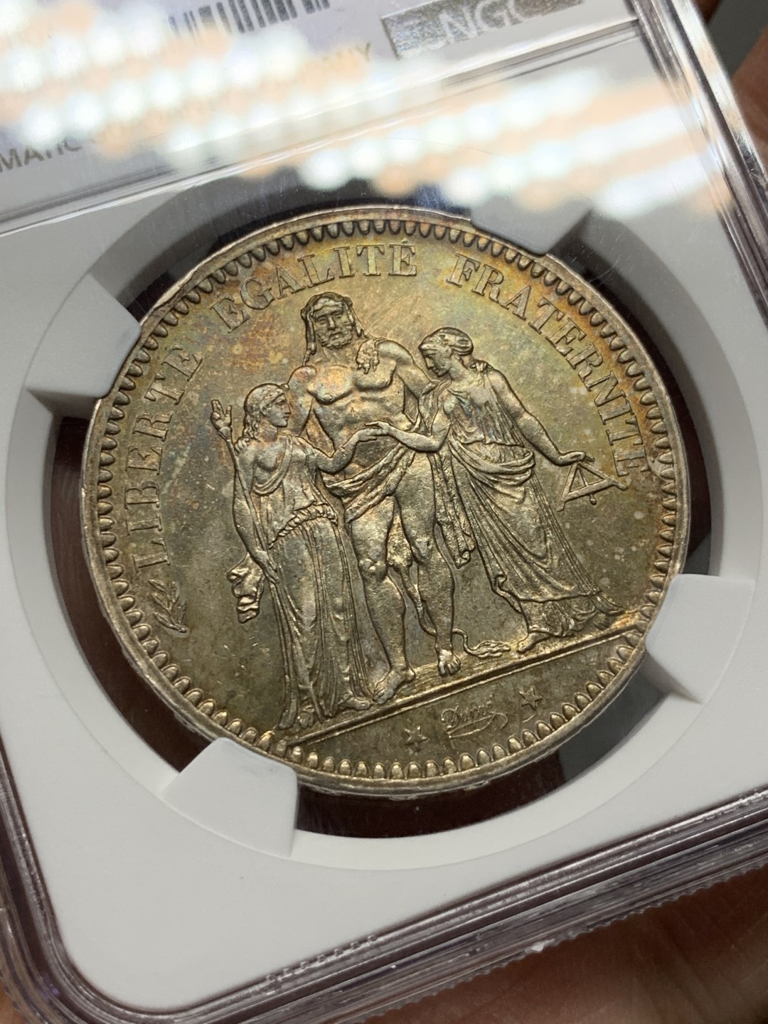 《竞宝斋》第143场-周日，周一 2场 (全场包邮) NGC UNC  法国 1873年 大力神银币 好品低评包浆漂亮 MS的既视感