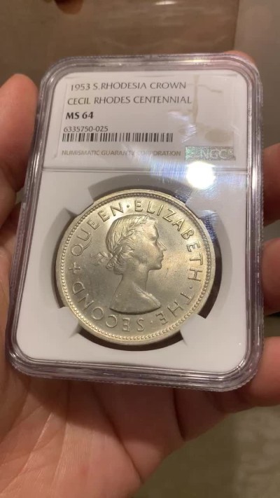 《竞宝斋》第143场-周日，周一 2场 (全场包邮) NGC  MS64 南罗德西亚1953年1克朗银币正面伊丽莎白二世女王背面殖民地头子伊安·史密斯发行的第一枚银币
