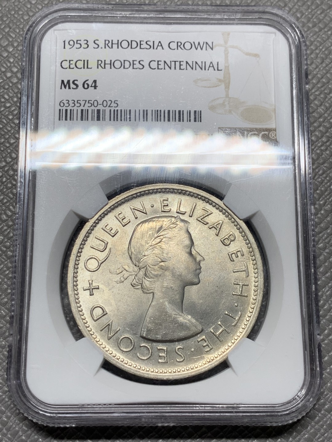 《竞宝斋》第143场-周日，周一 2场 (全场包邮) NGC  MS64 南罗德西亚1953年1克朗银币正面伊丽莎白二世女王背面殖民地头子伊安·史密斯发行的第一枚银币