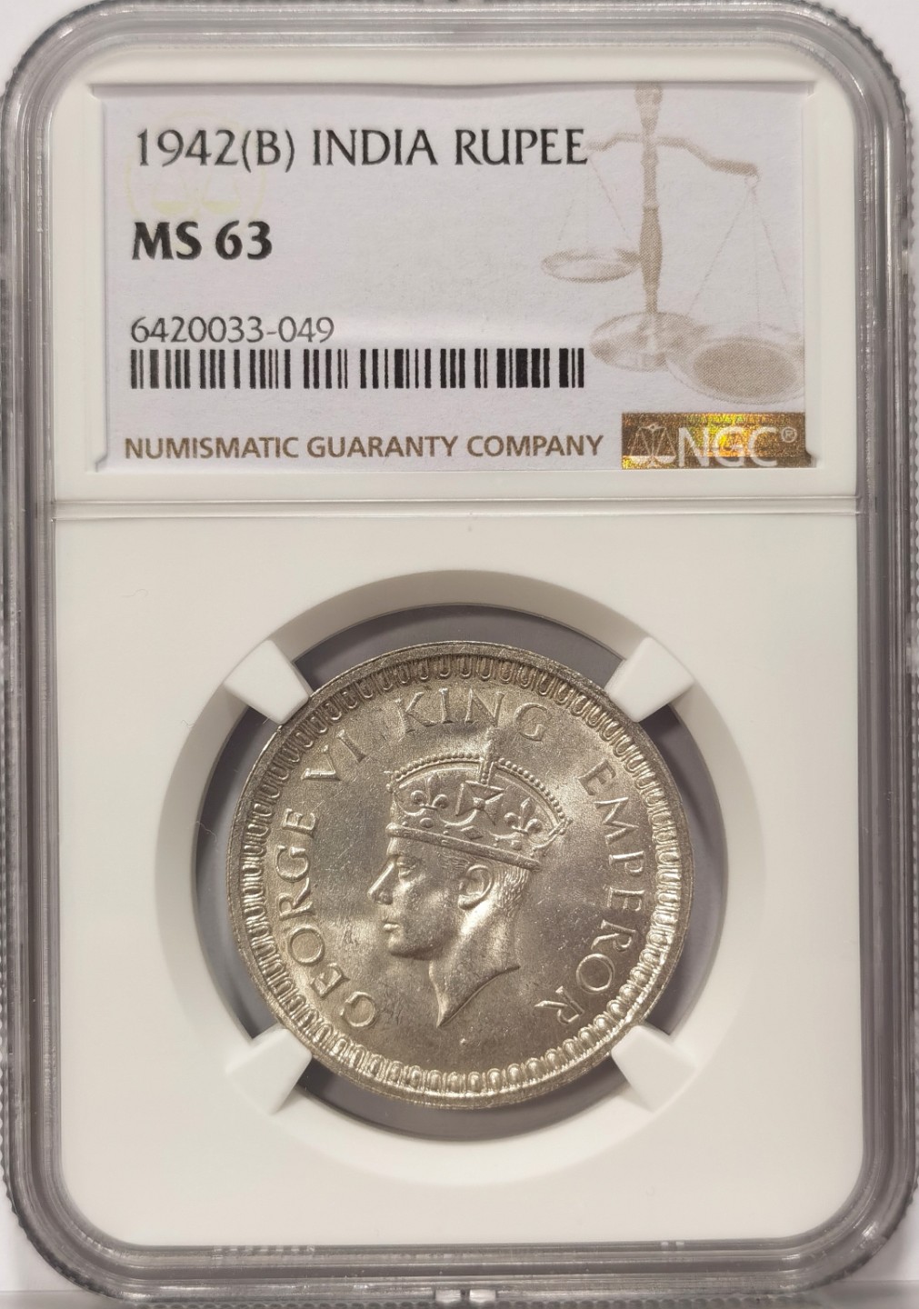 博洋堂世界钱币拍卖第019期（全场包邮） NGC MS63 英属印度1942年B版 乔治六世 1卢比银币 背面图案中心透打人面耳朵图案 上BU不易