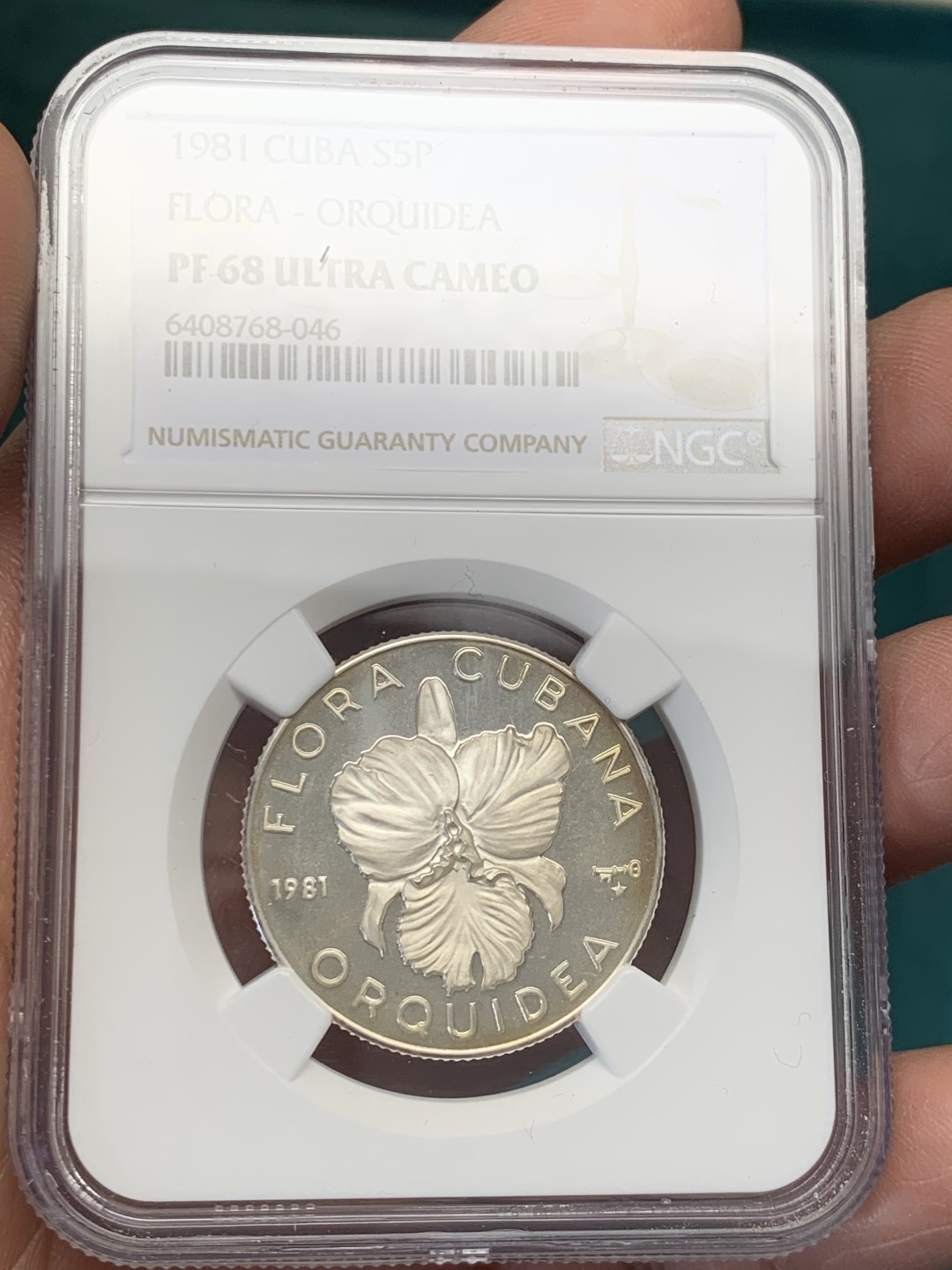 《竞宝斋》第146场-周日，周一 2场 (全场包邮) NGC-PF68 古巴1981年 兰花5比索精制银币 普制比较常见，精制很少