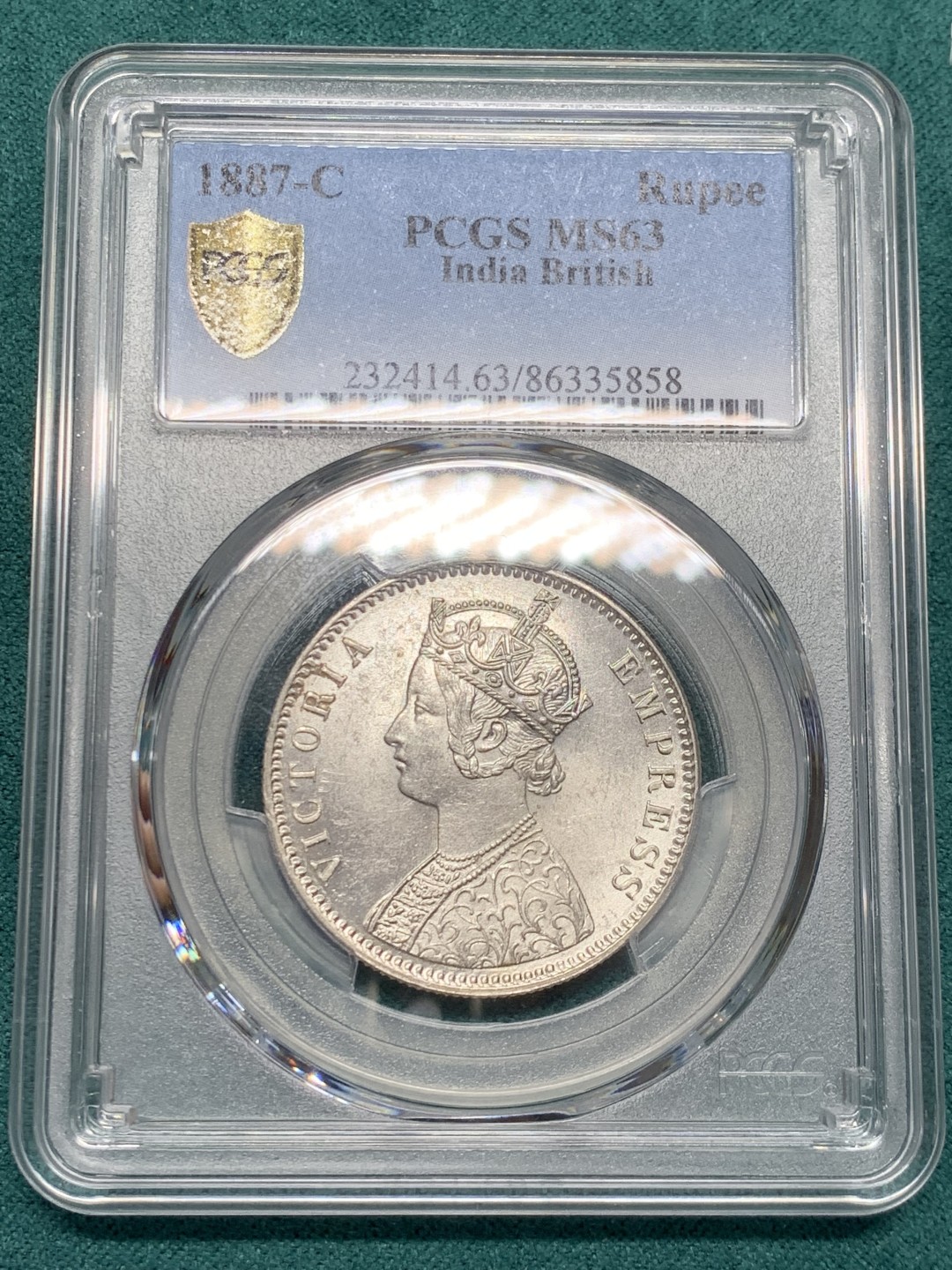《竞宝斋》第146场-周日，周一 2场 (全场包邮) PCGS-MS63 英属印度1887 维多利亚（小维）卢比 卷拆原光，品相完美