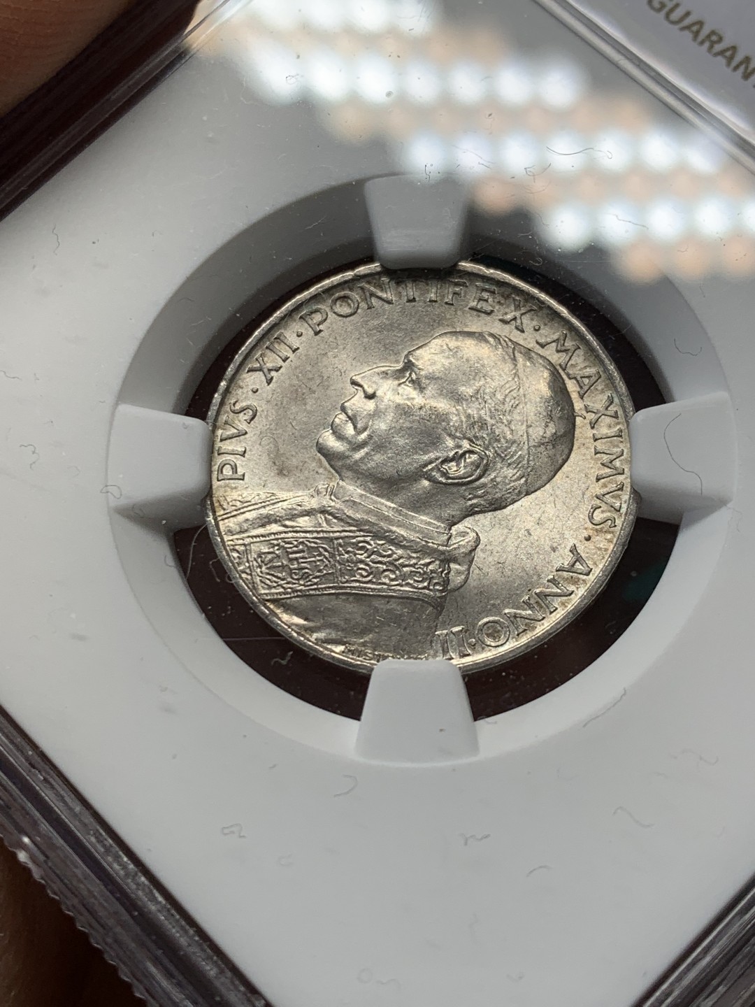 《竞宝斋》第146场-周日，周一 2场 (全场包邮) NGC MS63 梵蒂冈1940年5里拉银币 人像为庇护十二世 背面造型刻画的是彼得乘船传递讯息