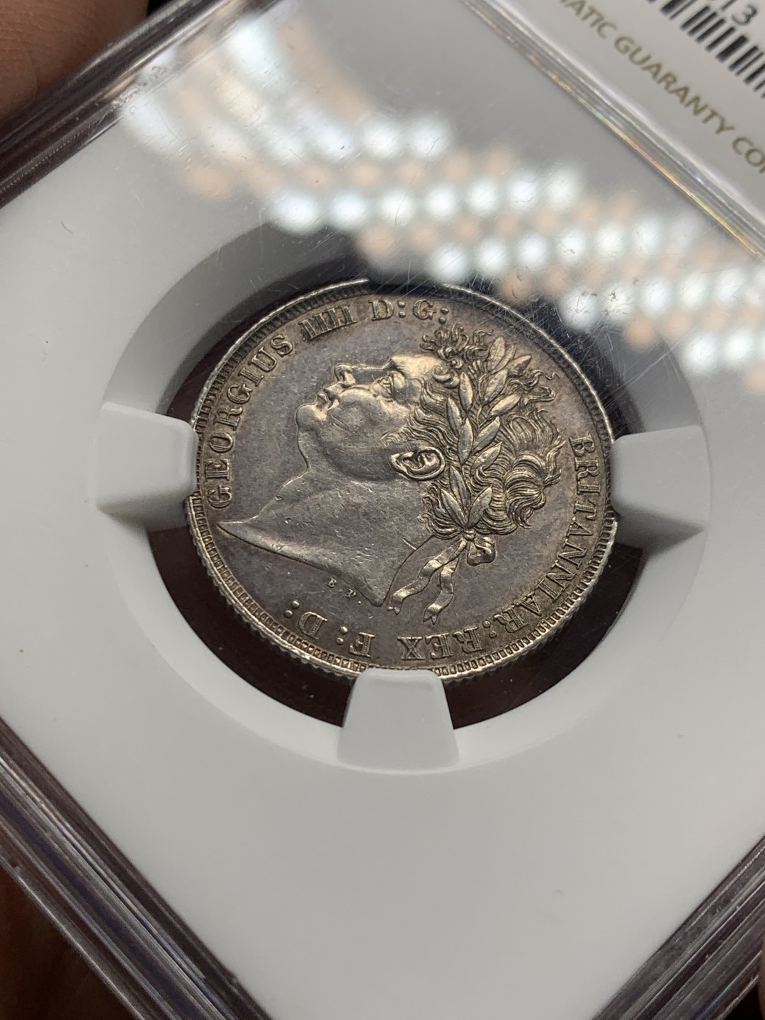 《竞宝斋》第146场-周日，周一 2场 (全场包邮) NGC-AU55 英国 1821年乔治四世三花版1先令银币 著名单年版本，漂亮的三花。实物转光，状态很好，给分略显保守