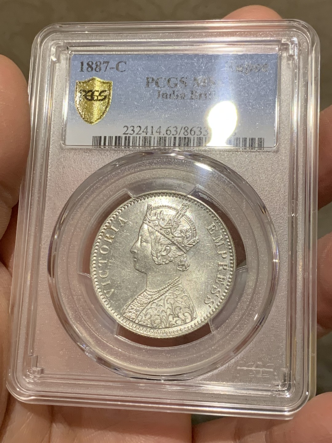《竞宝斋》第146场-周日，周一 2场 (全场包邮) PCGS-MS63 英属印度1887 维多利亚（小维）卢比 卷拆原光，品相完美