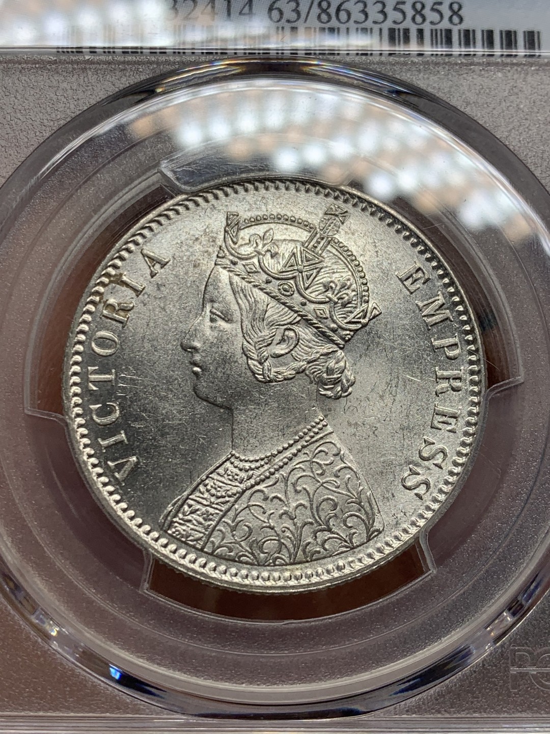 《竞宝斋》第146场-周日，周一 2场 (全场包邮) PCGS-MS63 英属印度1887 维多利亚（小维）卢比 卷拆原光，品相完美