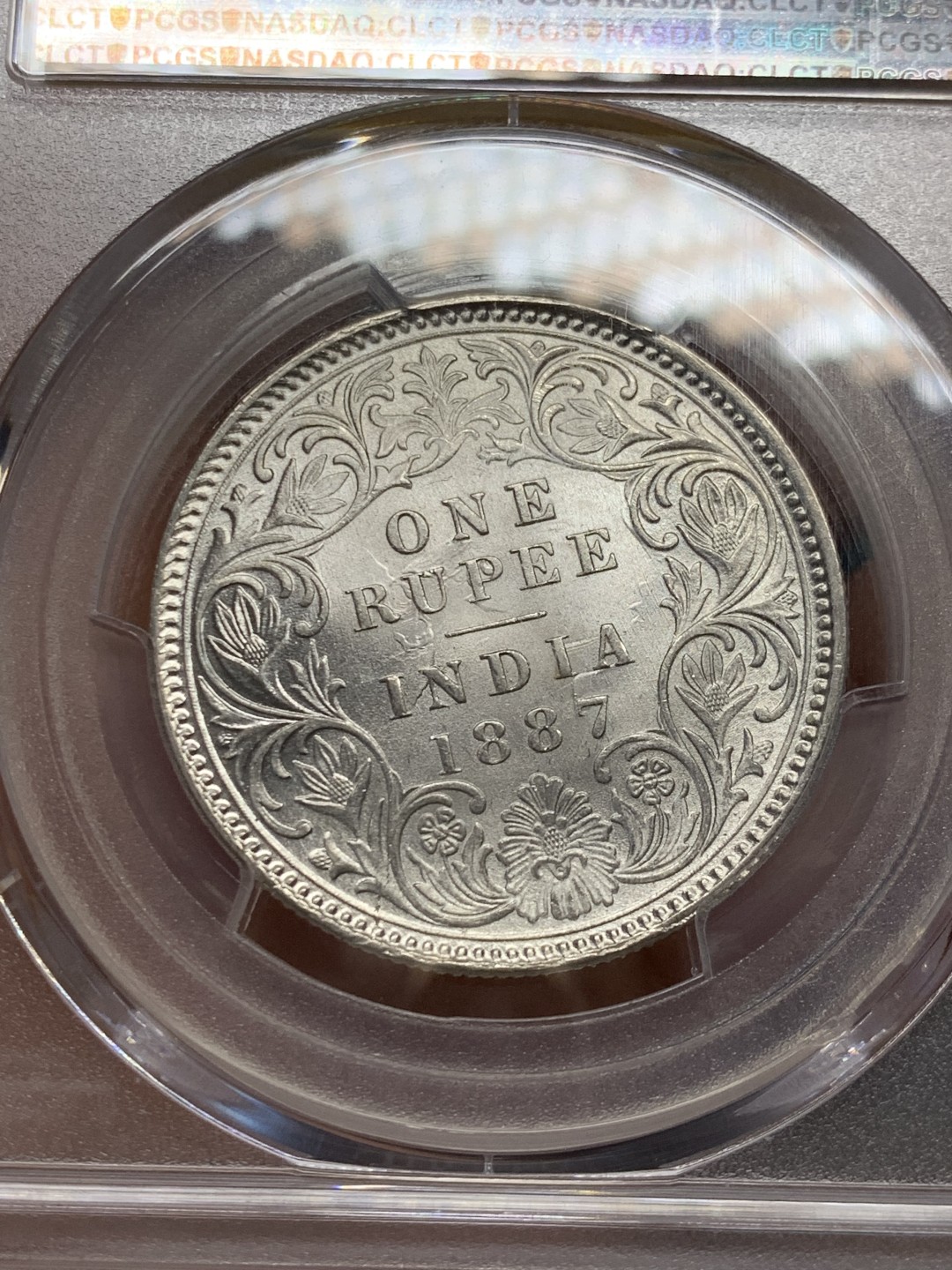 《竞宝斋》第146场-周日，周一 2场 (全场包邮) PCGS-MS63 英属印度1887 维多利亚（小维）卢比 卷拆原光，品相完美