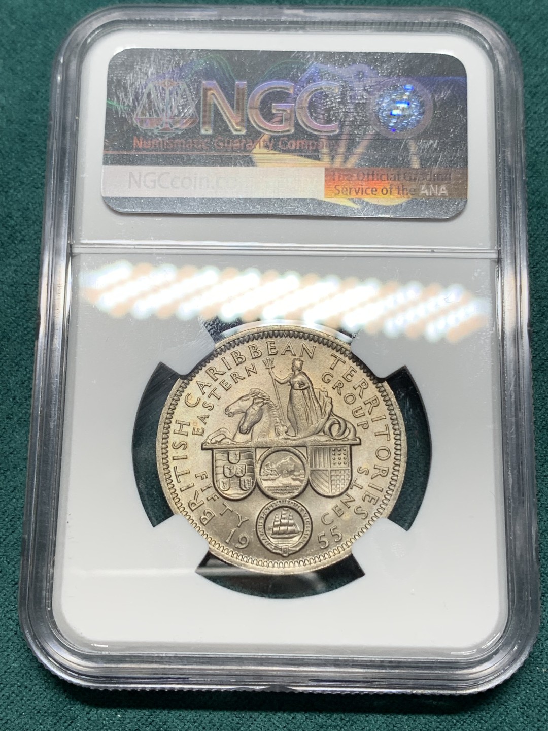 《竞宝斋》第147场-周日，周一 2场 (全场包邮) NGC MS64英属东加勒比1955年50分背面女王手握波塞冬的三叉戟并控制着马头鱼尾的神兽是希腊神话中的Hippocampu是，象征着掌握东加勒比海的海洋霸权